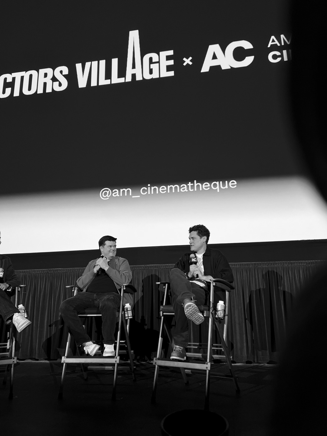 Phil Lord and Chris Miller on stage at the Directors Village after a Project Hail Mary screening, black and white