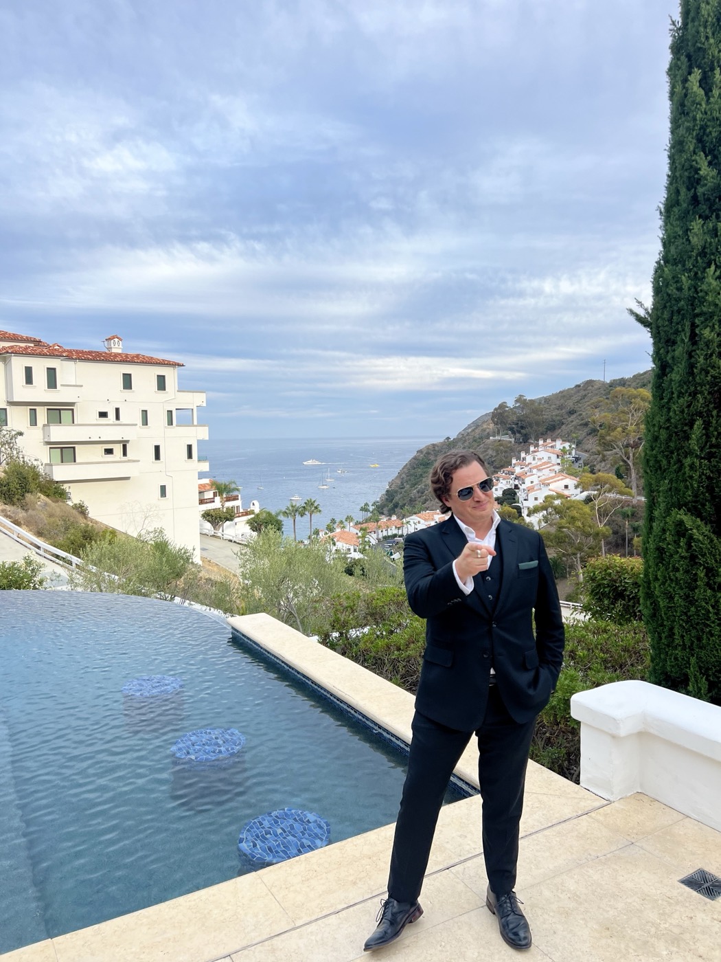 Jason Pelsey beside an infinity pool high in the hills above Avalon Harbor at a filmmakers' party