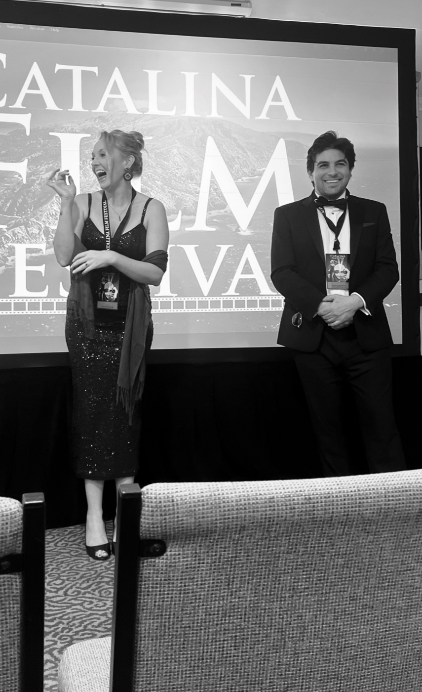 Stephanie Stuart and Remi Gangarossa on stage at the Catalina Film Festival after the Marilyn's Dark Paradise screening, black and white