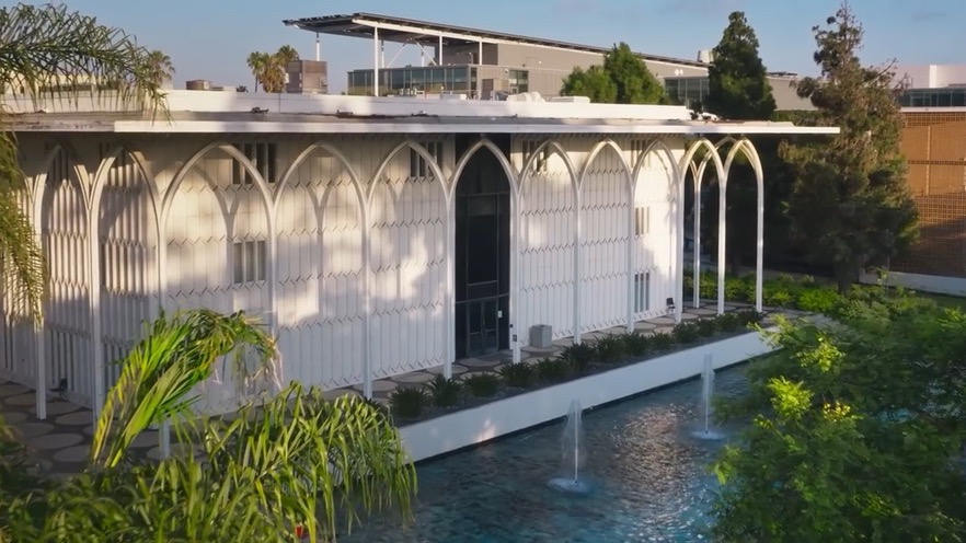 Aerial view of the Foley Theatre's white arches and fountain pool at Loyola Marymount University, from LMU's Ignite a Brighter World film